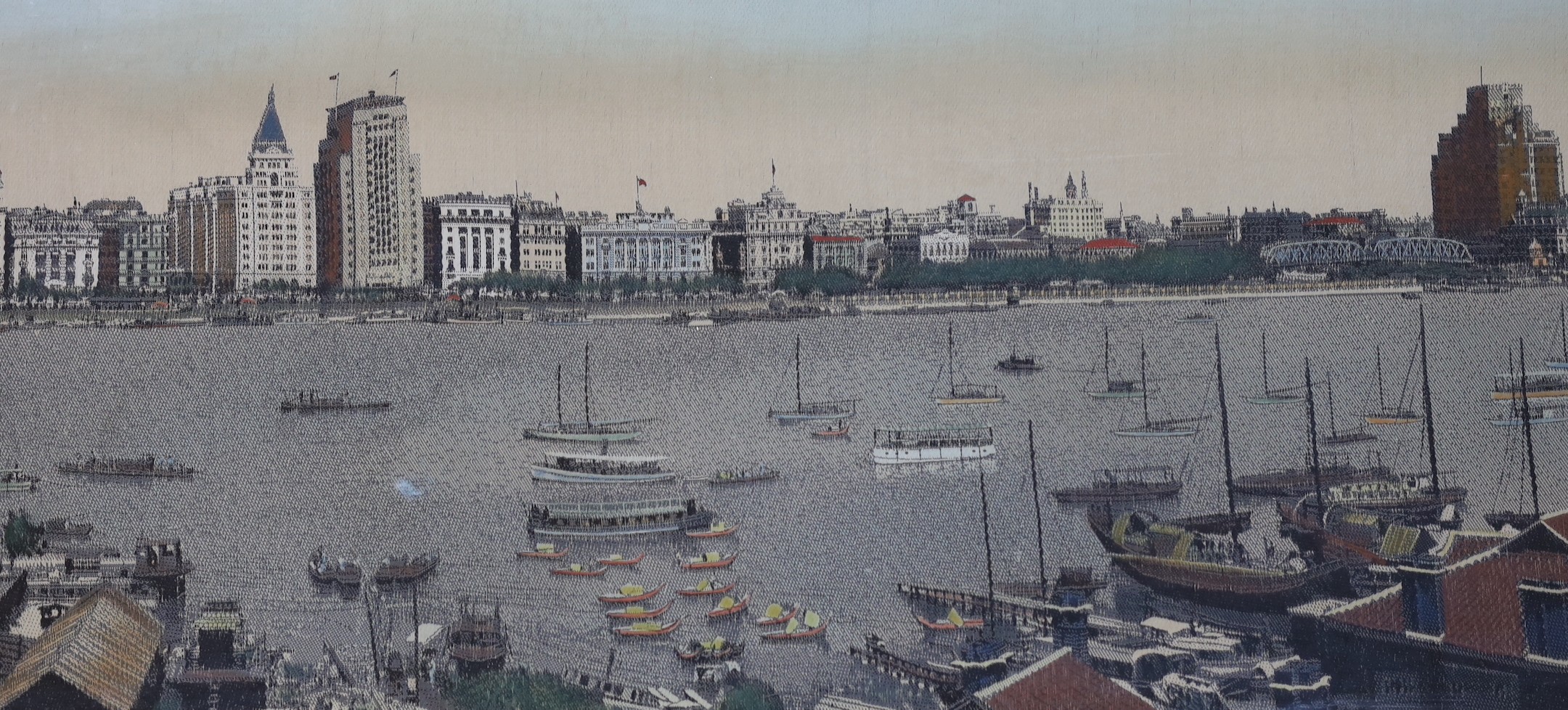 A framed early 20th century Chinese machine woven panorama of Shanghai harbour, 39x165cm excl frame